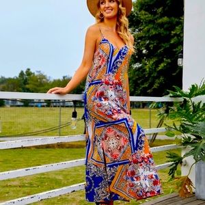 Summer slit hem flowing dress with spaghetti straps.